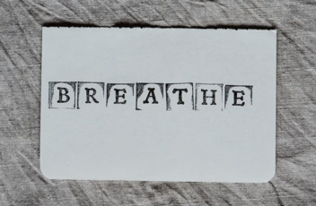 The word breathe is stamped on to a white paper 